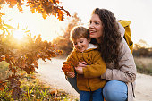 Mother and son enjoying a carefree autumn day in nature