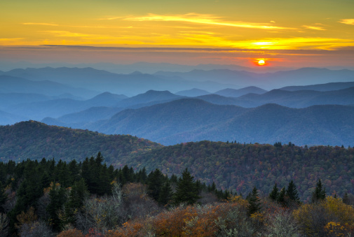 Blue Ridge Parkway Autumn Sunset over Appalachian Mountains Layers covered in fall foliage and blue haze
