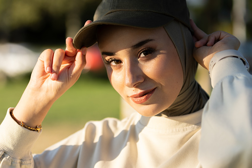 Portrait of hijab lady wearing sport clothes at public park.\nLocation : Istanbul - Turkey