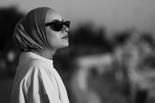 Portrait of hijab lady wearing sport clothes at public park.\nLocation : Istanbul - Turkey\nB&W photography.