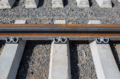 Reinforced concrete rail fastening rails to the sleeper. Spring-loaded metal fastening of the railway track
