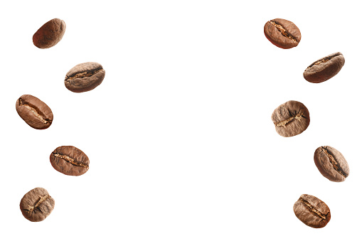 Roasted coffee beans on the white background with copy space