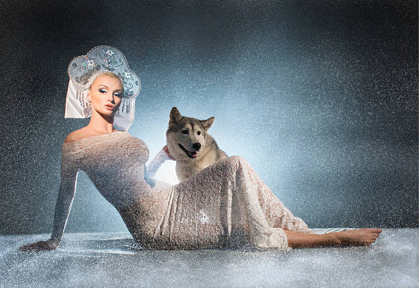 Beautiful snow maiden with dog