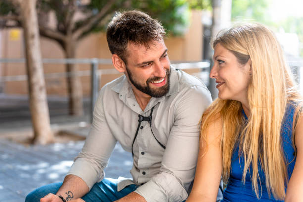 istock couple looking at each other in love smiling 1605098688