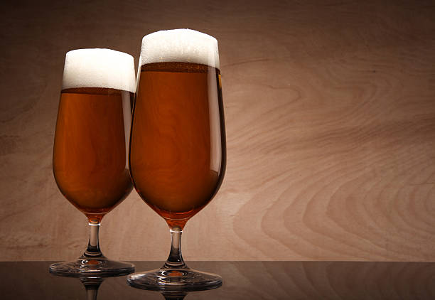 Two glasses with beer stock photo