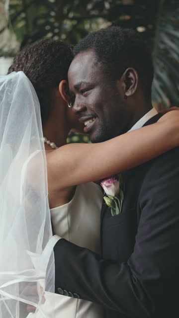 Bride and Groom Embracing during Wedding Ceremony