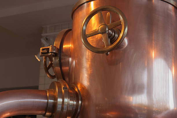 copper tank with faucet stock photo