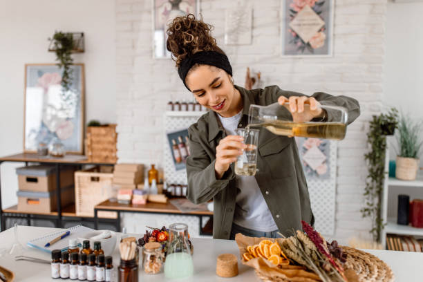 istock Woman testing new perfume note in her cosmetics workshop store 1605142067