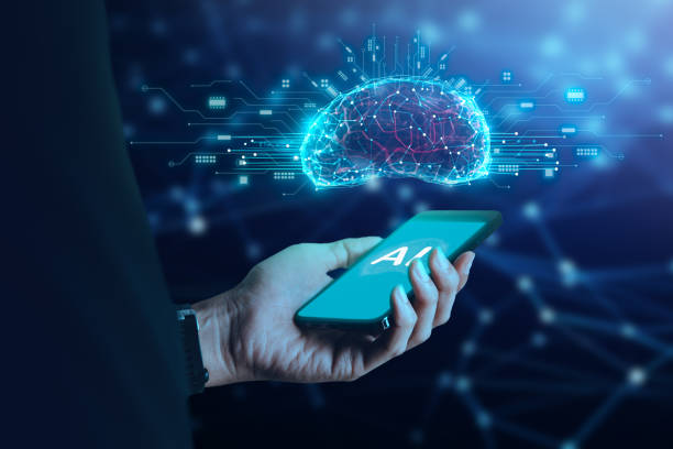 istock Businessman holding mobile phone with  AI icon artificial intelligence on screen and brain above.big data, science, innovation technology, cloud computing, futuristic, internet network communication concept 1605145073