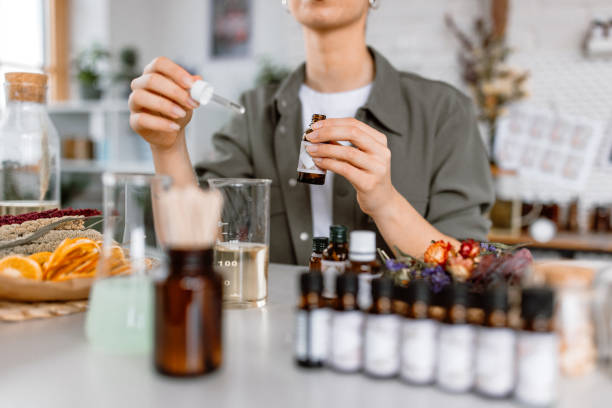 istock Woman testing new perfume note in her cosmetics workshop store 1605146918