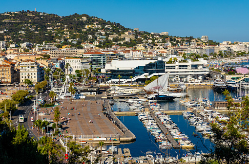 Cannes, France - July 31, 2022: Cannes city center with yacht port and marina and film festival Palace of Festivals and Congresses at Boulevard de la Croisette on French Riviera