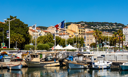 Cannes, France - July 31, 2022: Cannes city center seafront panorama with historic old town Centre Ville quarter and yacht port onshore Mediterranean Sea of French Riviera