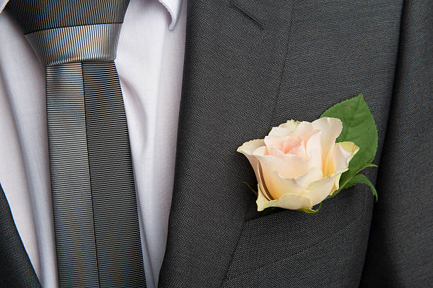 istock rose boutonniere flower on groom's wedding coat 160515821