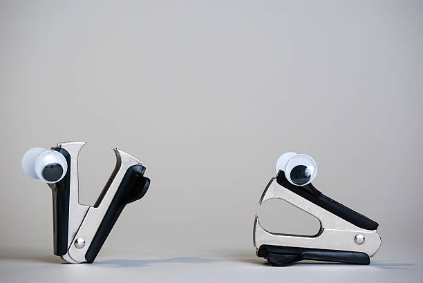 The orange staple remover isolated on white background