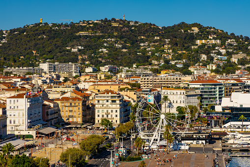 Cannes, France - July 31, 2022: Cannes city center panorama with historic old town Centre Ville quarter and yacht port onshore Mediterranean Sea of French Riviera
