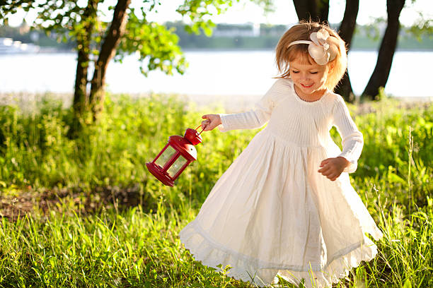 Little girl dancing with lantern