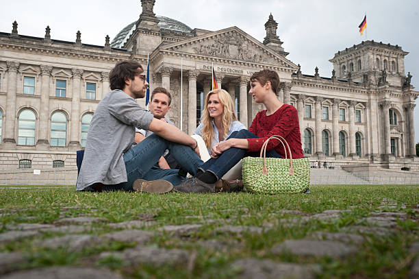 istock Four friends sitting outdoors 160517252