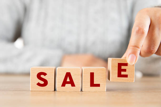 istock Wooden Cube Block with Sale Word 1605186228