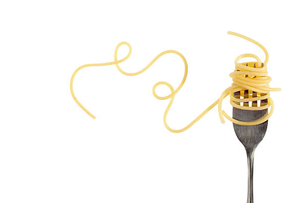 Pasta Swirls of cooked spaghetti fork photos stock pictures, royalty-free photos & images
