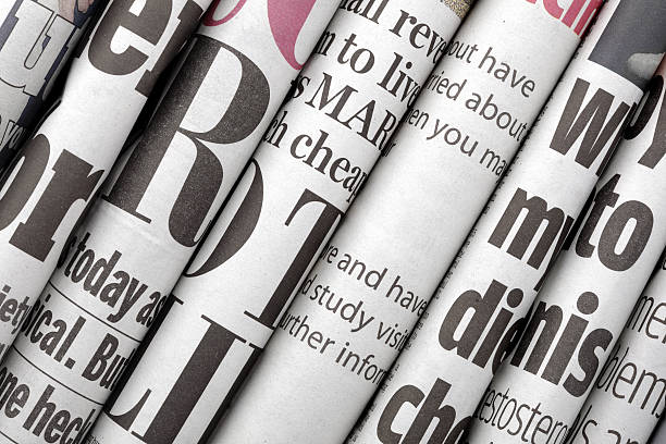 Newspaper headlines Newspaper headlines shown side on in a stack of daily newspapers newspaper headline photos stock pictures, royalty-free photos & images