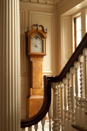 This is a grandfather clock inside an historic mansion.