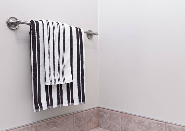 Blue towel hanging on a hanger to use in bathroom