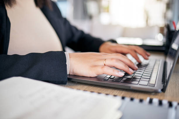 istock Hands, typing and laptop in office with notebook, planning or post schedule for blog content creator. Copywriting woman, website manager and computer with keyboard, ideas or social media in workplace 1605202070