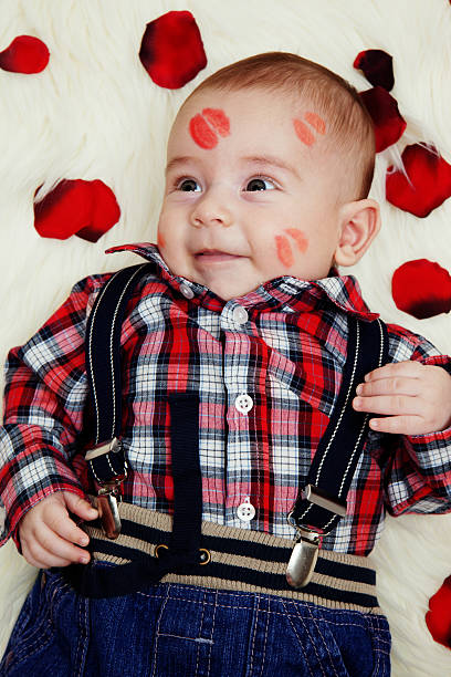 istock Smiling cute baby boy with lipstick on his face 160520294