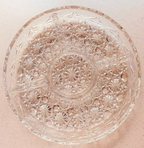 istock Overhead shot of an ornate crystal dish. 1605211317