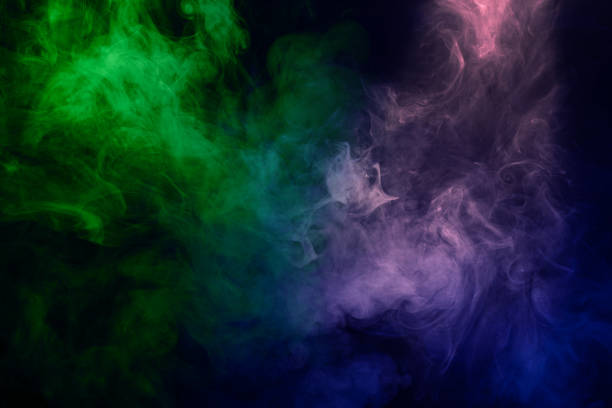 istock Green and pink steam on a black background. 1605214932