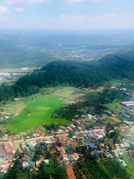 istock Mountains and Field under the Wings 1605226573