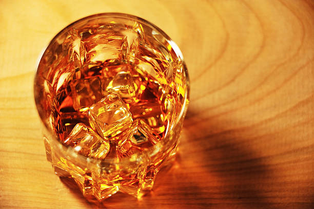 istock Glass of whiskey with ice top view 160525805