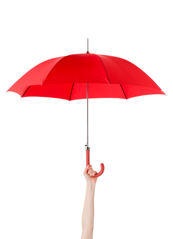Close up of opened umbrella in hand, isolated on white