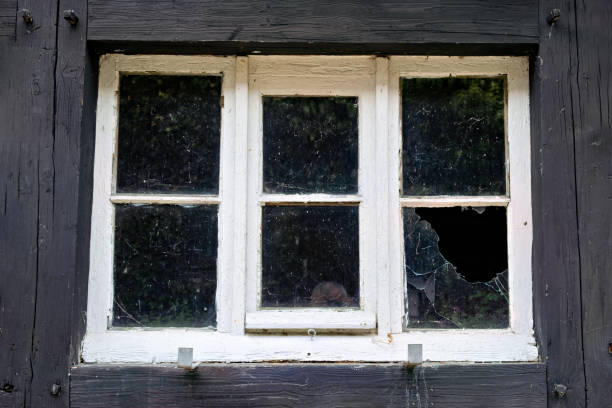 istock Broken window in wooden building 1605264852