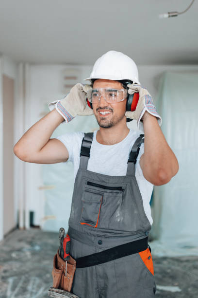 istock Construction worker renovating apartment with safety helmet 1605284804