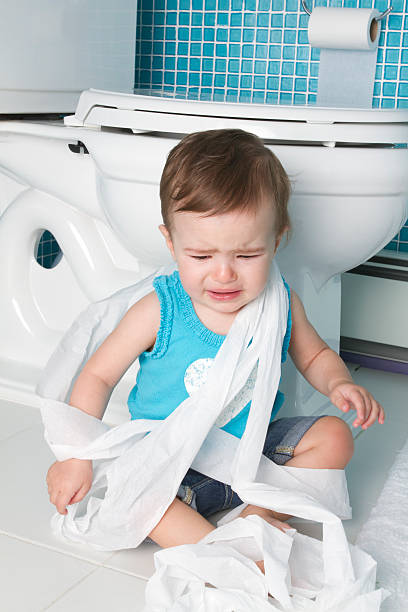 istock baby playing with toilet paper 160528709