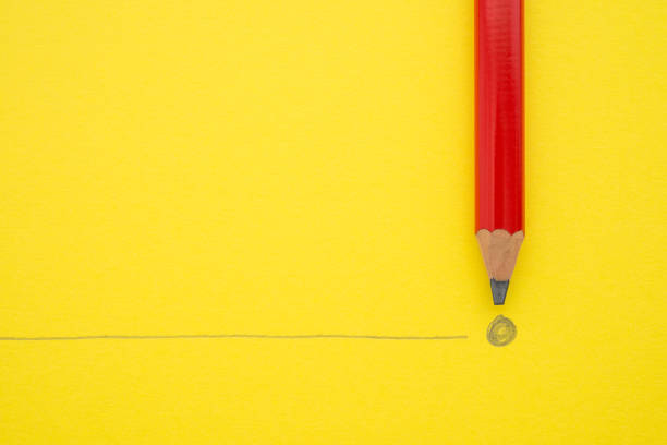 istock Black pencil write the end point on yellow paper background with copy space. 1605315365