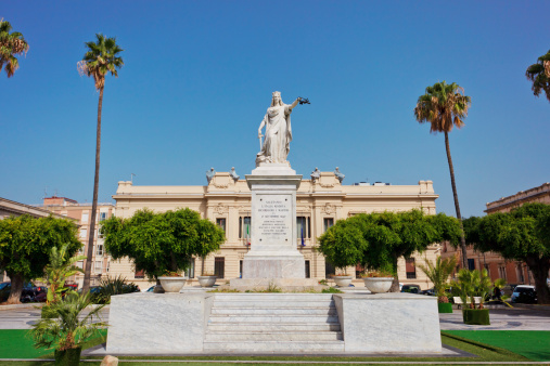 Monument in liberty style expressing salute to revived Italy near palace of prefecture in Reggio Calabria, Italy