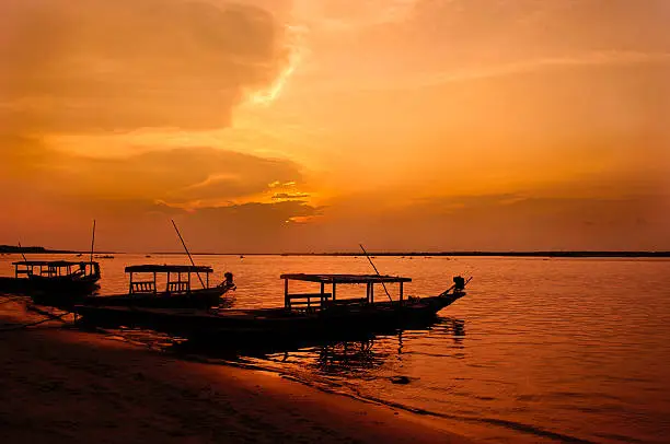 Chilika Lake is the world's second largest lagoon, situated in Orissa, India. The crimson light in the dusk adds a new dimension to the beautiful lake