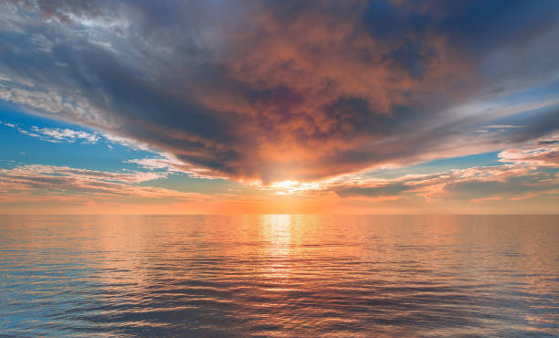 istock Natural background with sunrise and stormy clouds in Mediterranean sea reflection 1605338477