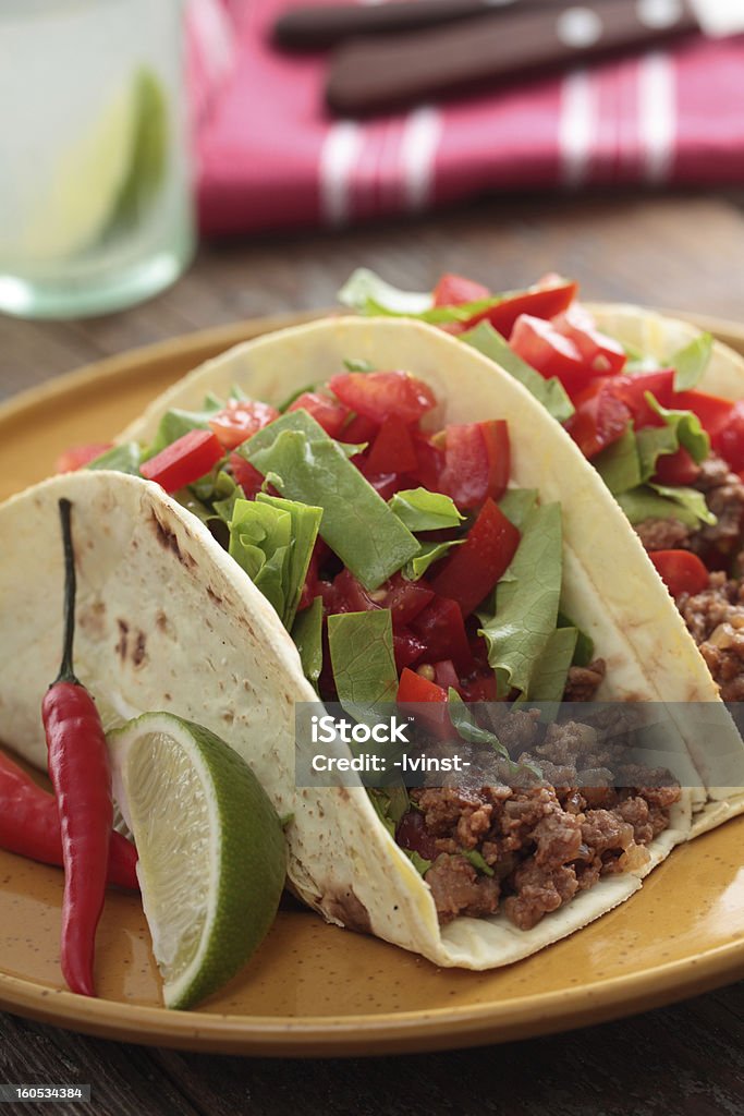 Tacos with ground beef and vegetables Tacos with ground beef and vegetables on a rustic table Beef Stock Photo