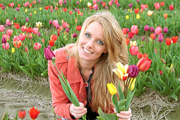 istock Young dutch woman between de flower fields in the Netherlands 160534749
