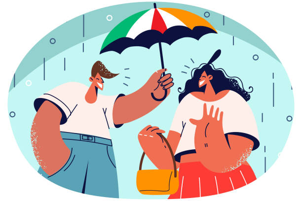 istock Smiling man cover woman with umbrella 1605356088