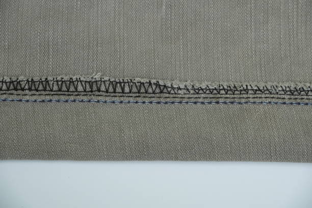 istock Denim jeans stich , close up view, beige color 1605363369