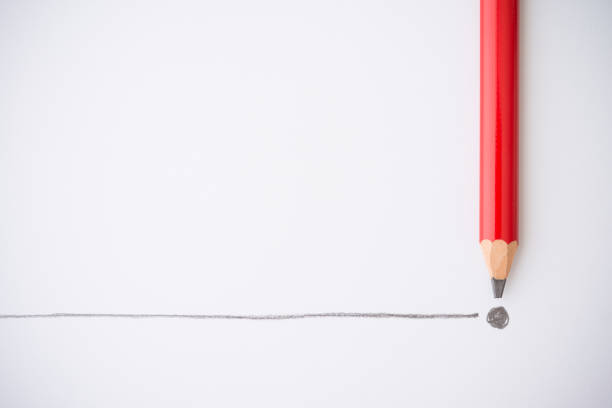 istock Flat lay of red color pencil write line and end point on white paper background copy space. 1605369433