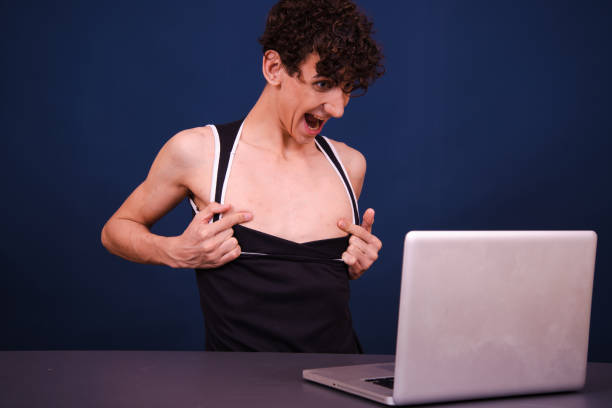 Funny silly guy chatting online and watching adult movies. Happy man perv stock pictures, royalty-free photos & images