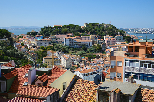 Picturesque panoramic daytime view of Lisbon city, view from observation point. Sunny summer day and scenics view to the downtown architecture rooftops. Portugal. Capital cities and landmarks