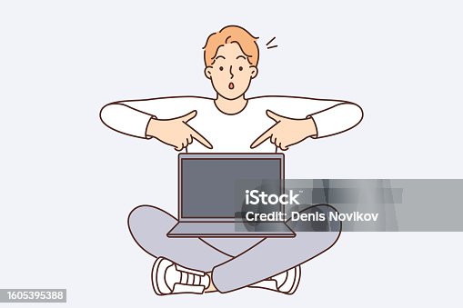 istock Shocked man with laptop pointing fingers at screen recommending visiting interesting website 1605395388