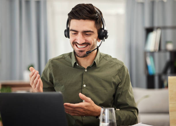 istock Laptop, smile and man in home office for webinar, video call and remote work with streaming seminar. Communication, technology and training online, freelancer working as advisory consultant in lounge 1605398587