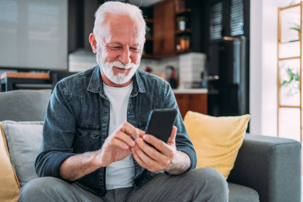 istock Cheerful man having video call at home. 1605404633